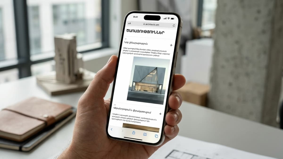 Mobile screen displaying a services list in Armenian, showing sections for "New Construction" with a modern concrete building photo and "Renovation and Reconstruction".
