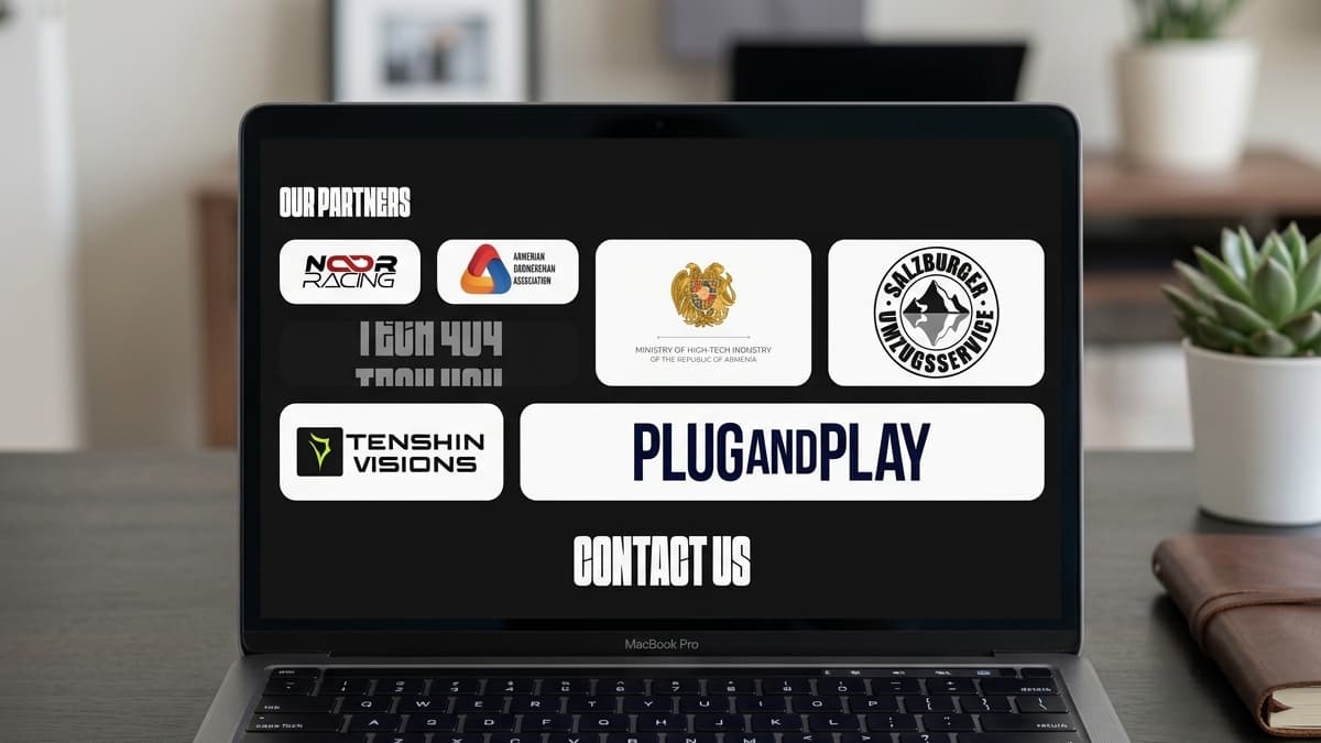 Laptop screen displaying a partners logo showcase page titled "OUR PARTNERS" with cards for Noor Racing, Ministry of High-Tech Industry of Armenia, Tenshin Visions, and Plug and Play.
